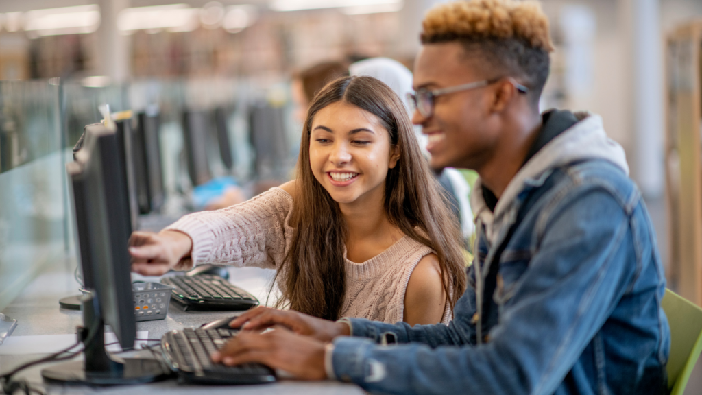two students working on the computer together